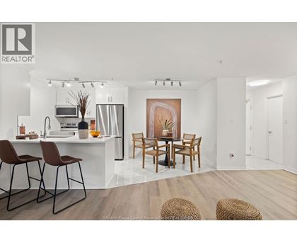 A modern kitchen with a dining table set up.