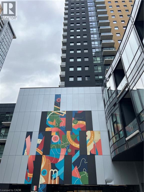 A tall building with a colorful mural on its side.
