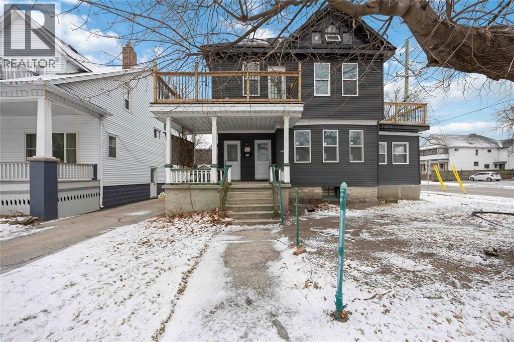 A house with a sign that says REALTOR in the background.