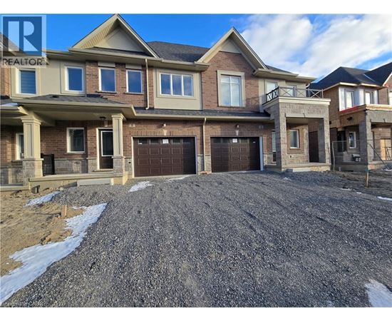 A large, multi-level house with a garage is shown in the image.