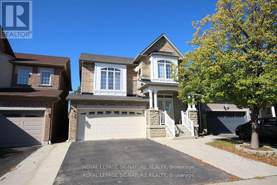 A house with a driveway in front of it and a sign that says Royal LePage Signature Realty, Brokerage.