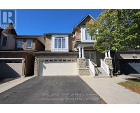 A house with a driveway and garage is for sale with Royal LePage Signature Realty in Brockville.