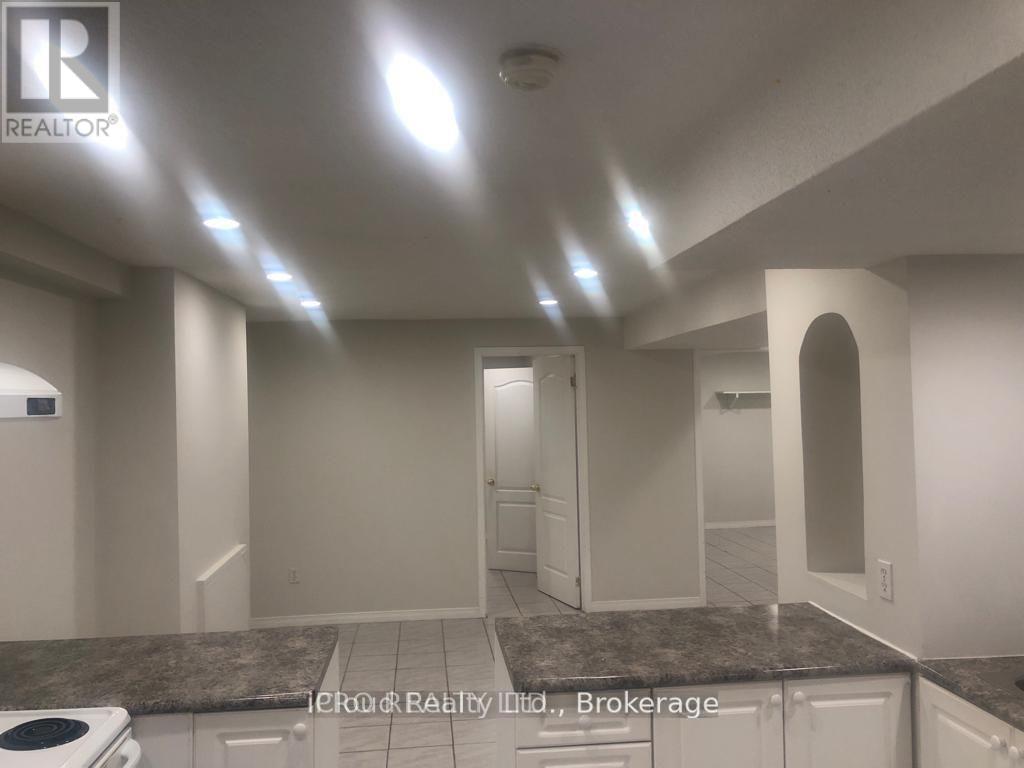 A realtor brokerage image of a kitchen with granite countertops.