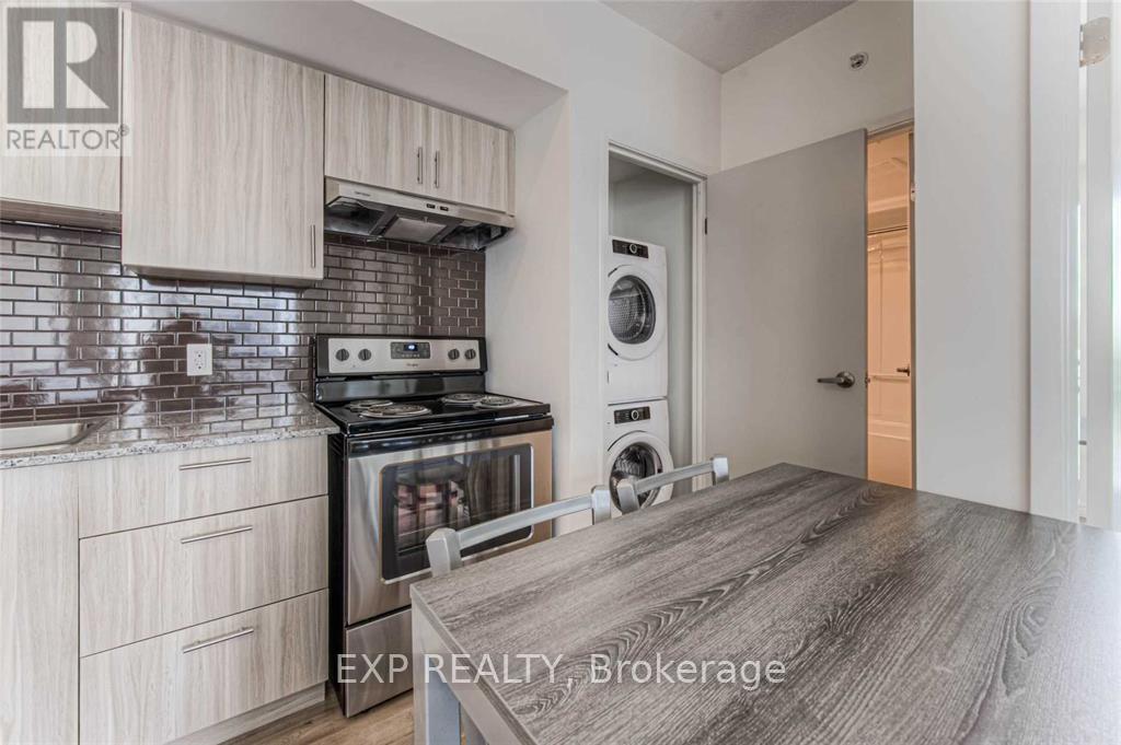 A kitchen with a stove top oven and a dishwasher.