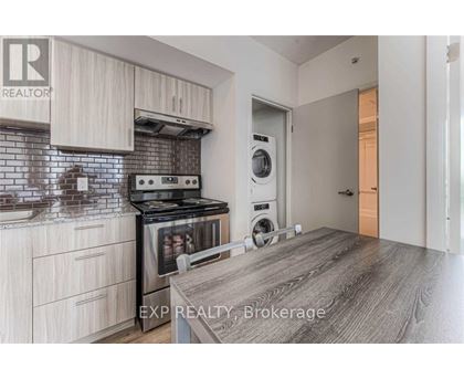 A kitchen with a stove top oven and a dishwasher.