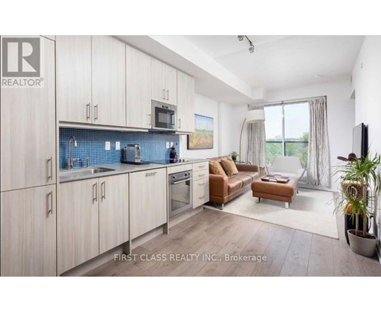 A modern kitchen with wooden cabinets and a blue backsplash.