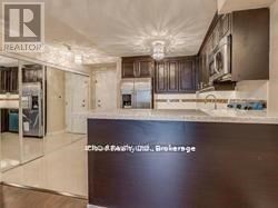 A modern kitchen with a large island in the middle.