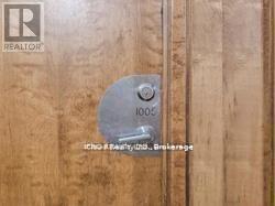 A Realty sign is on a door.