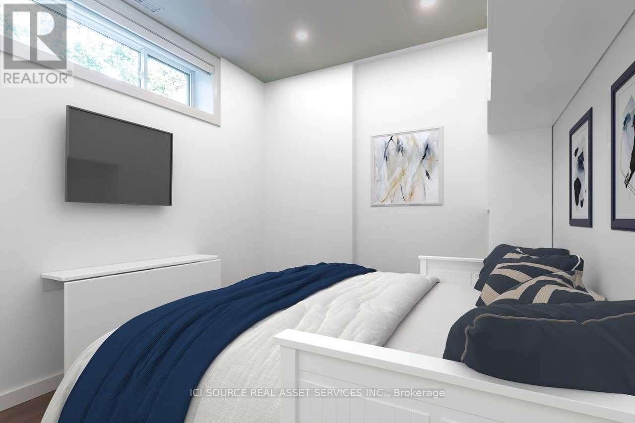 A bedroom with a bed, a television, and two pictures on the wall.
