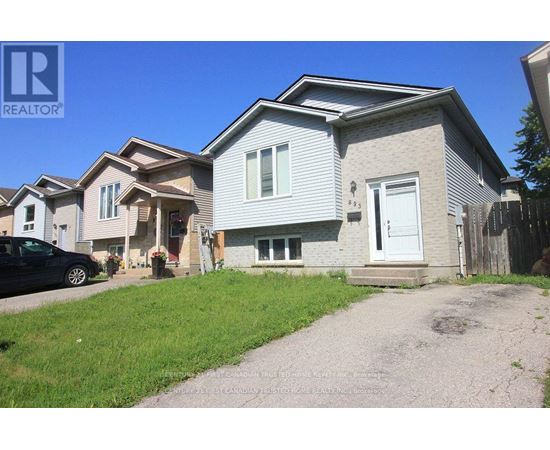A house with a car parked in front of it.
