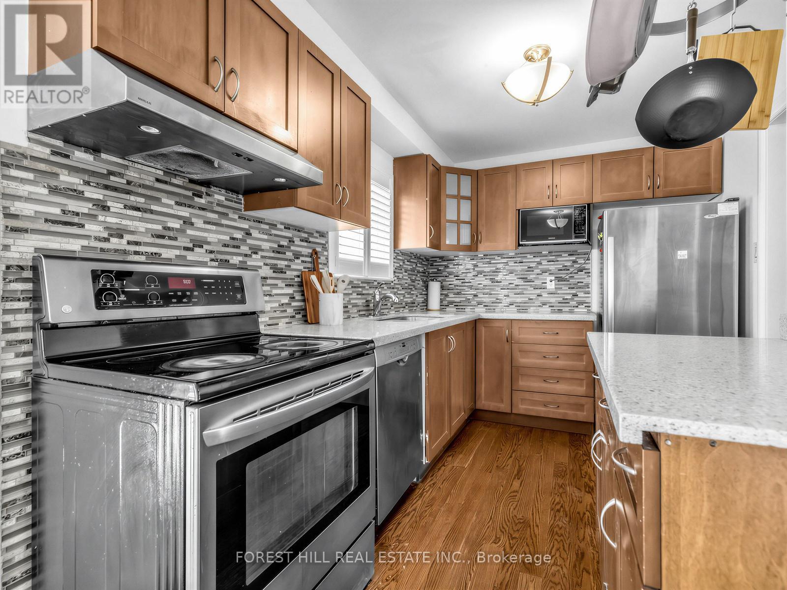 A kitchen with a stove top oven and a microwave.