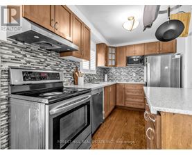 A kitchen with a stove top oven and a microwave.