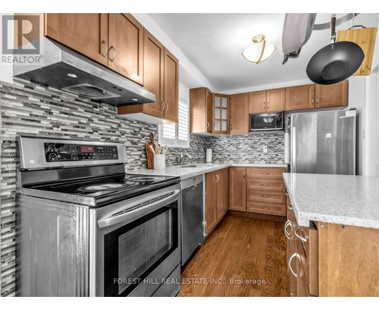 A kitchen with a stove top oven and a microwave.