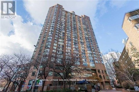 A tall building with a glass facade is the Royal LePage Goldenbridge Realty Brokerage.