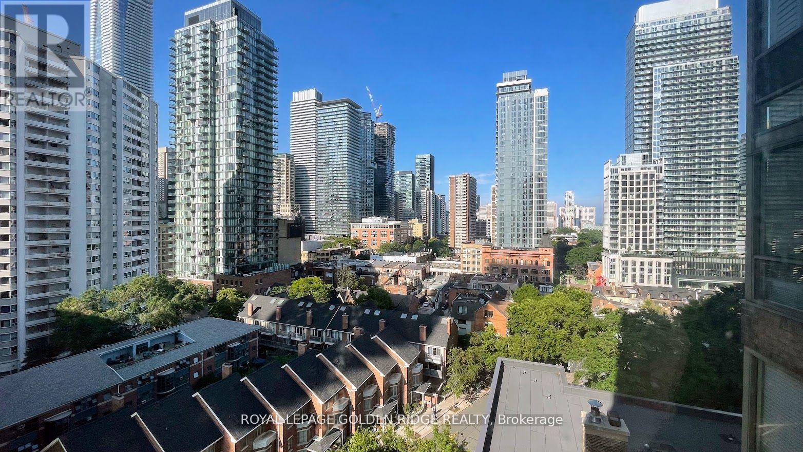 A cityscape with a mix of high-rise buildings and low-rise buildings.