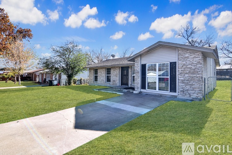 A house with a driveway in front of it.
