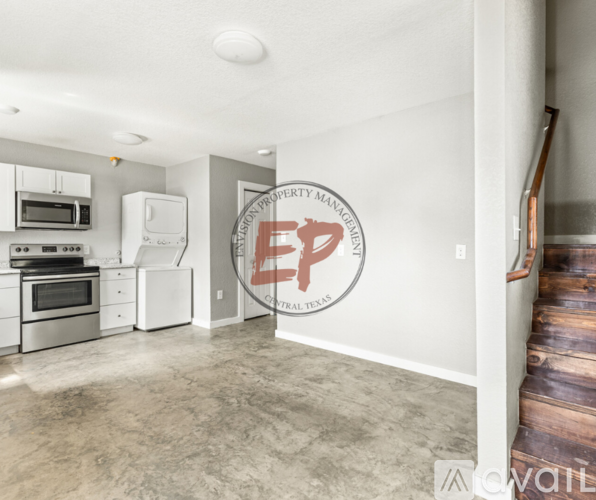 A kitchen with a logo on the wall that says "EP".