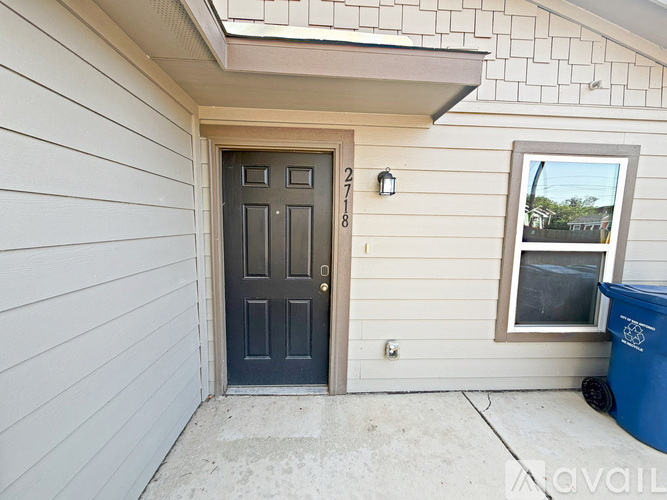 A blue door with the number 27818 on it.