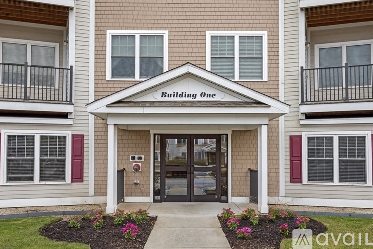 The front of Building One with a sign on the roof.