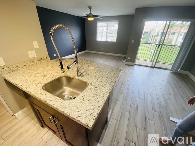 A kitchen with a sink and a faucet.