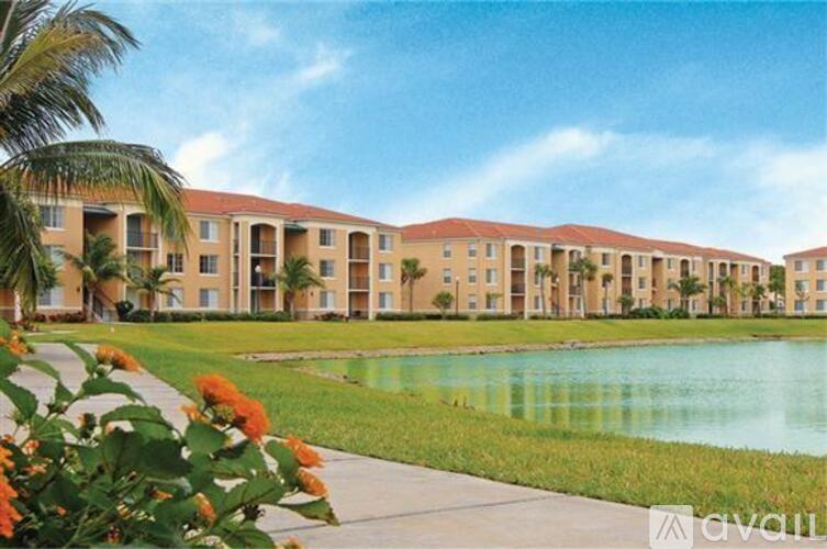 A building with a pool in front of it.