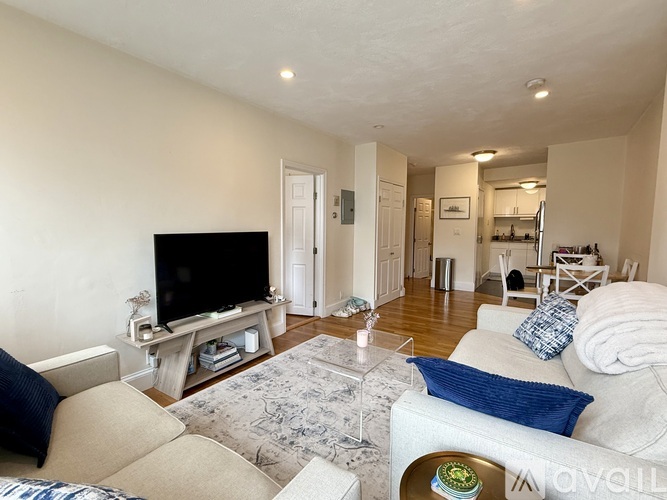 A living room with a television and a couch.