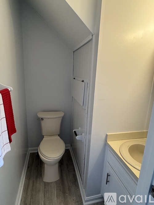 A bathroom with a toilet and a sink.