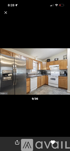 A kitchen with wooden cabinets and stainless steel appliances.