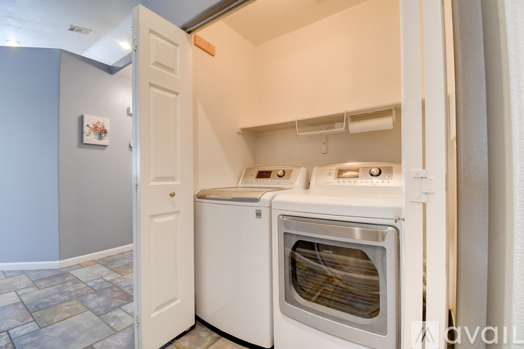 A white oven and microwave are in a kitchen.