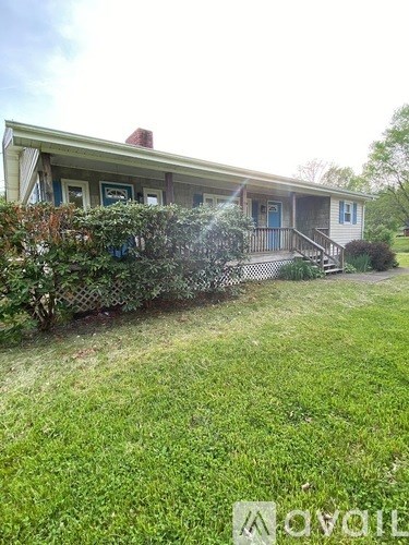 A house with a blue door and a porch.