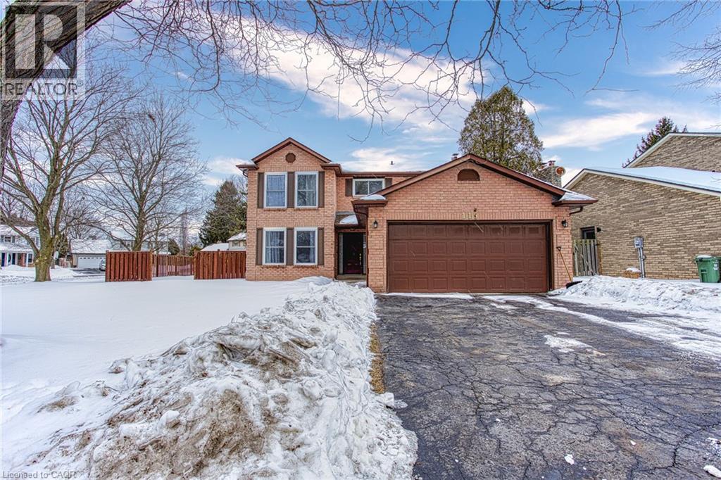 A house with a brown brick exterior and a brown garage door.