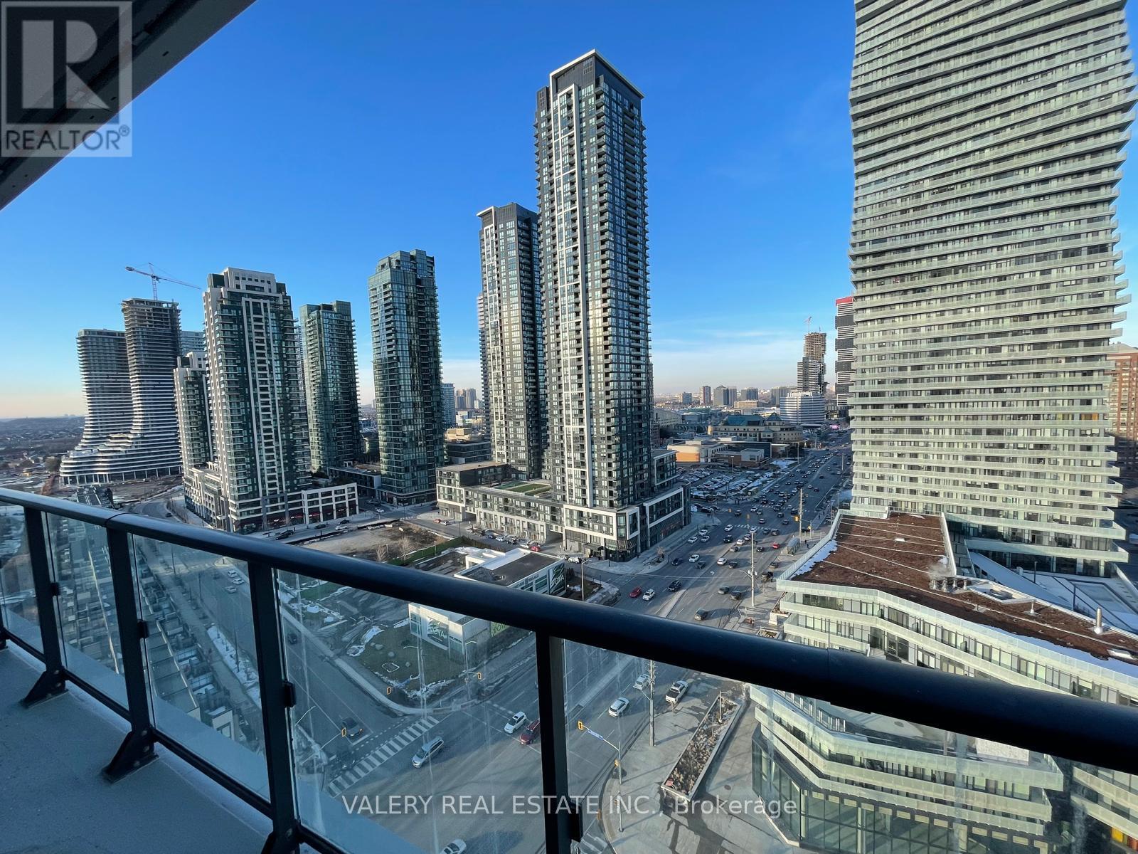 A cityscape with tall buildings and a clear sky.