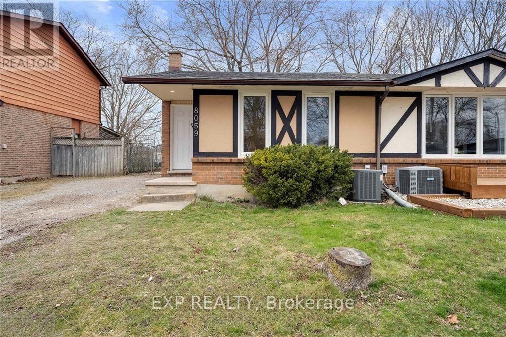 A house with a brown roof and a white door is for sale.