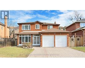 A house with a brick facade and a white garage door.