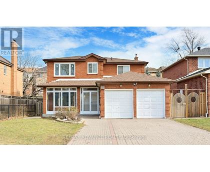 A house with a brick facade and a white garage door.
