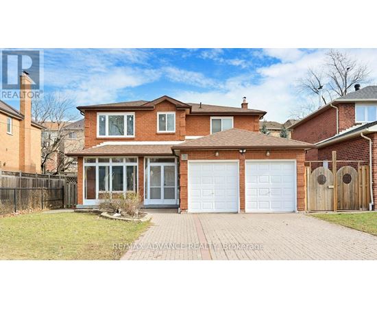 A house with a brick facade and a white garage door.