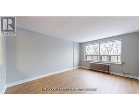 A room with a window and a radiator is for sale.