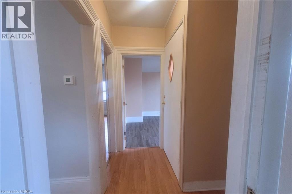 A hallway with a door at the end.