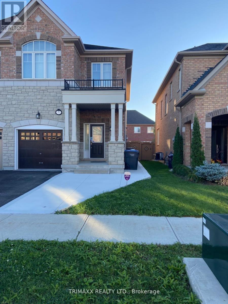 A house with a brick facade and a large front yard.
