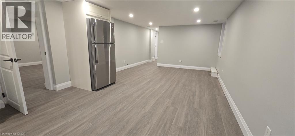 A spacious room with a Realtor sign on the door.