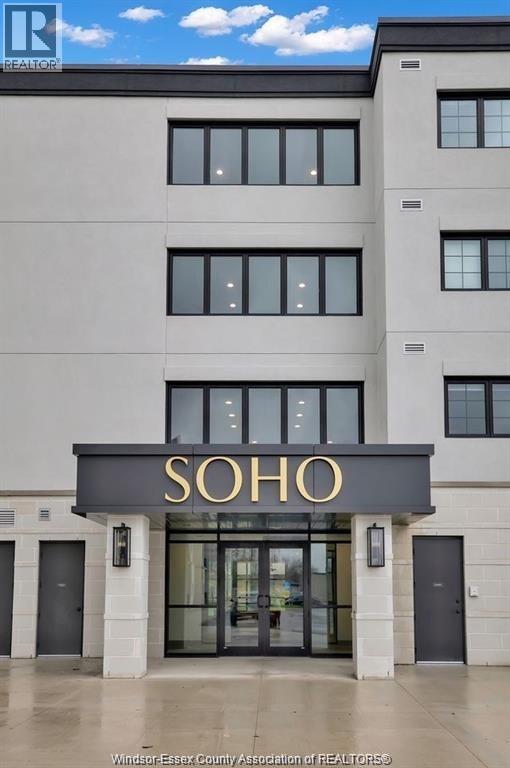 A building with a black and gold sign that says "SOHO".