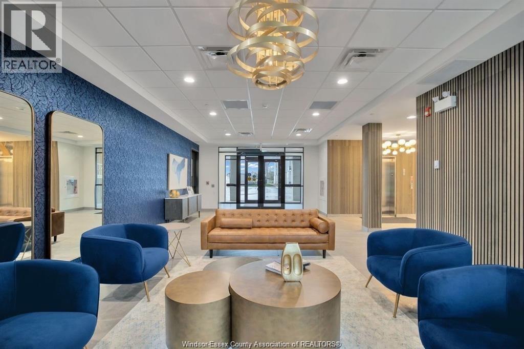 A modern office space with blue chairs and a wooden sofa.