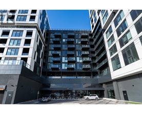 A modern building with the sign RE/MAX DASH REALTY-BROKERED in front of it.