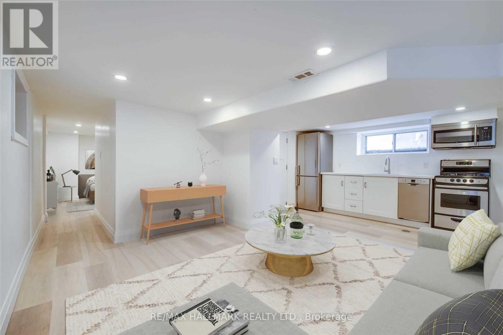 A modern living room with a coffee table in the center.