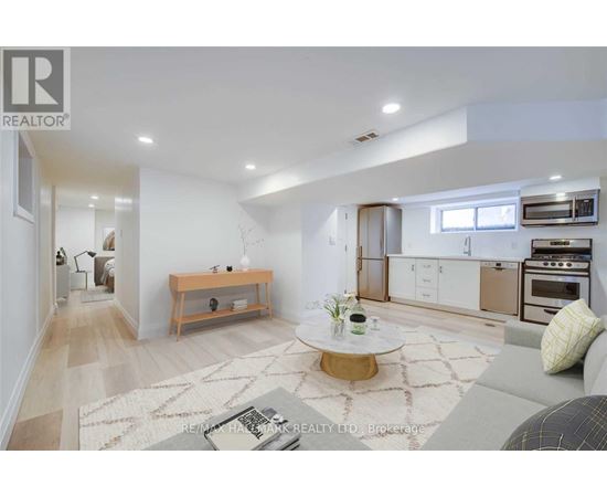 A modern living room with a coffee table in the center.