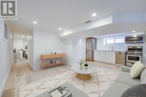 A modern living room with a coffee table in the center.