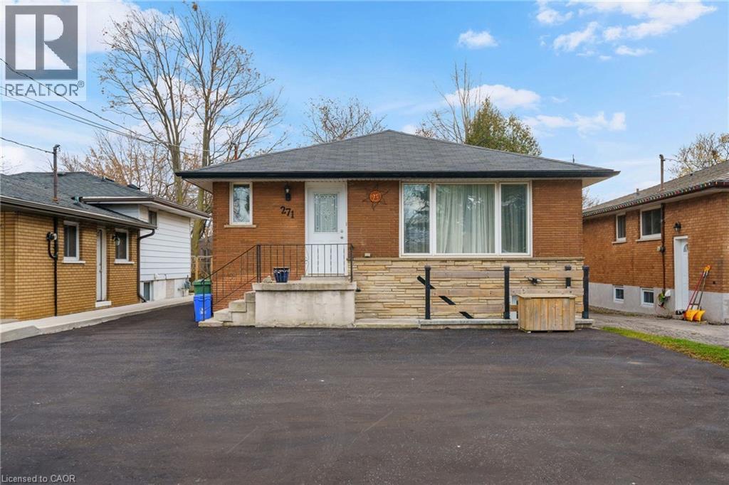 A house with a realtor logo in the corner.
