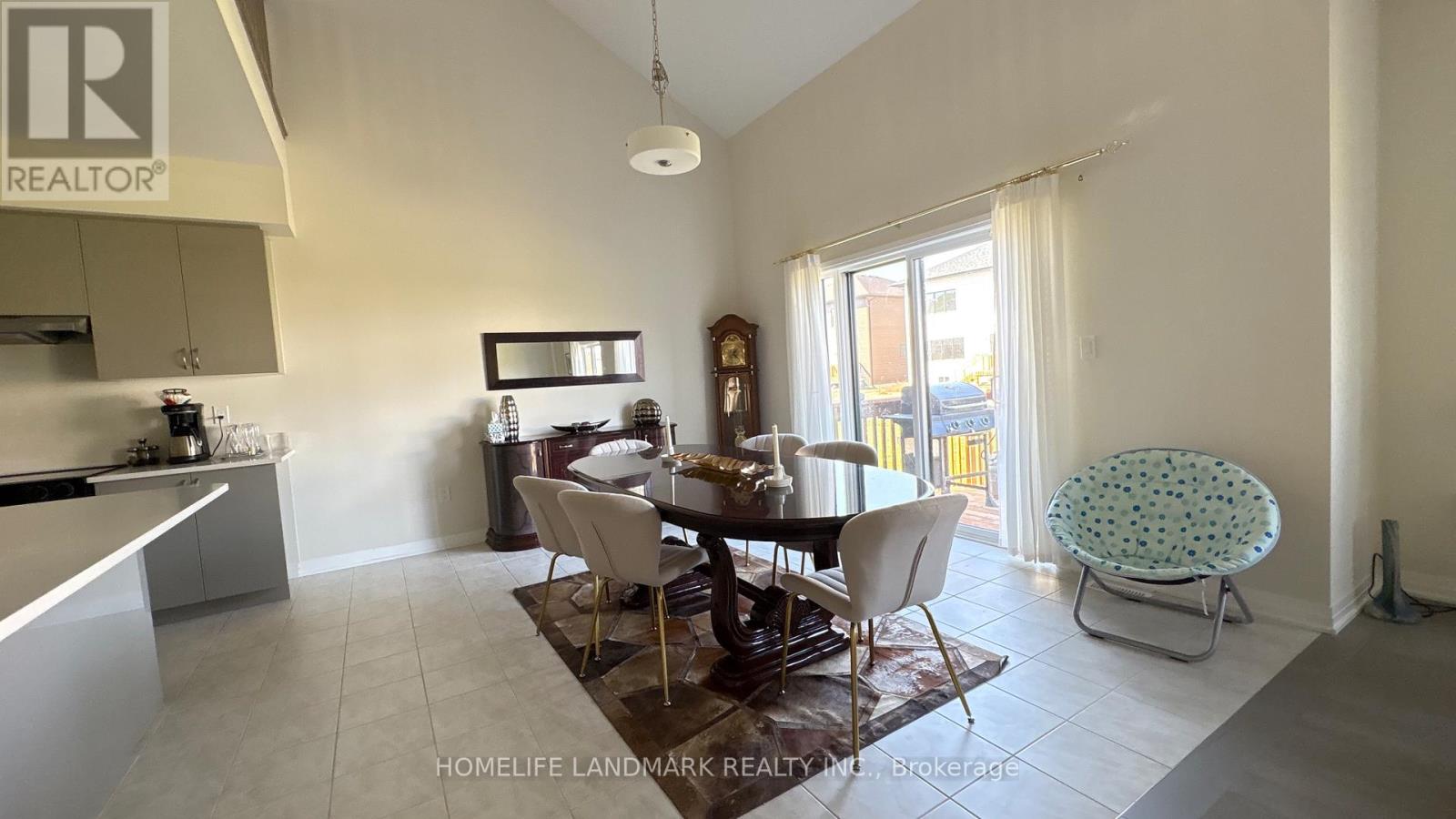 A dining area with a table set for four.