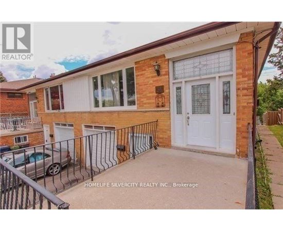 A brick house with a white door and windows is for sale.