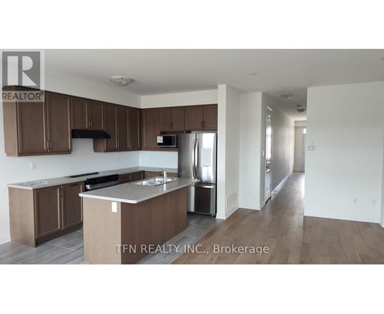 A kitchen with brown cabinets and a white countertop.